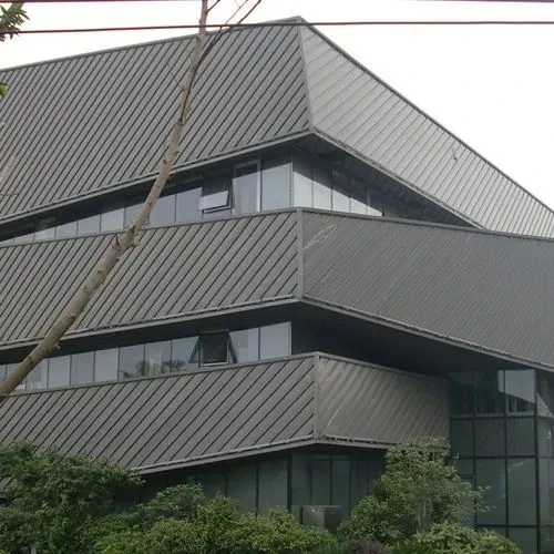 Vertical standing seam metal cladding