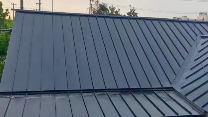Black standing seam metal roofing panels