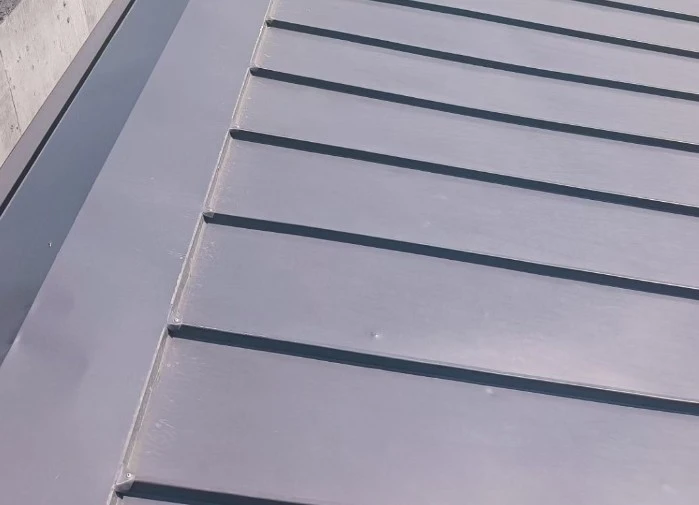 Striated standing seam metal roofing